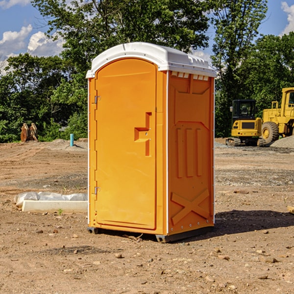 what is the cost difference between standard and deluxe portable restroom rentals in Newlin